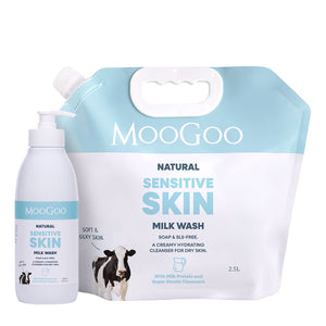 MooGoo Natural Sensitive Skin Milk Wash set, featuring a 2.5L refill pouch and a 500ml pump bottle, both in white and light blue packaging with a cow graphic. Low-irritant cleanser for face and body, paraben and SLS free. 