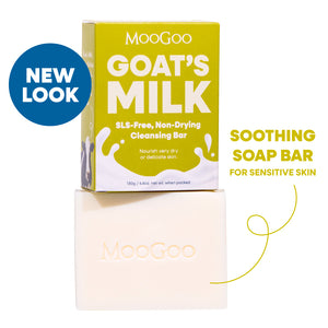 MooGoo Goat's Milk Soothing Cleansing Bar shown with its yellow-green packaging box and the bar itself on a white background, with text reading 'NEW LOOK' and 'SOOTHING SOAP BAR FOR SENSITIVE SKIN'. nourishing SLS-free cleansing bar to calm and hydrate delicate or irritated skin.