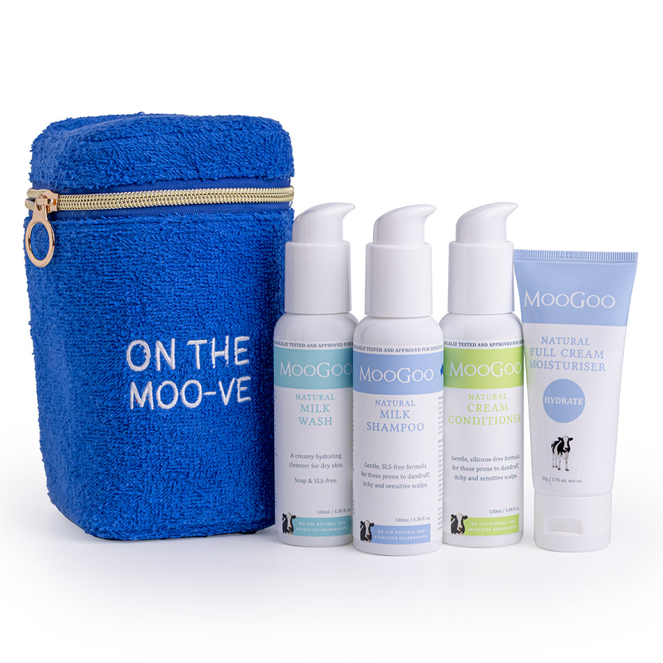 MooGoo Travel Pack on white background, including blue terry towelling bag, travel-sized Milk Shampoo, Cream Conditioner, Milk Wash and Full Cream Moisturizer - ideal for sensitive skin, hydration and scalp health