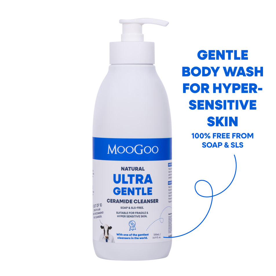 A white bottle of MooGoo Natural Ultra Gentle Ceramide Cleanser body wash with a pump dispenser, shown on a white background with blue promotional text on the right. For eczema prone and hypersensitive skin with ceramides to strengthen skin barrier. 